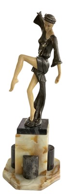 Lot 677 - A reproduction Art Deco bronzed dancer with...