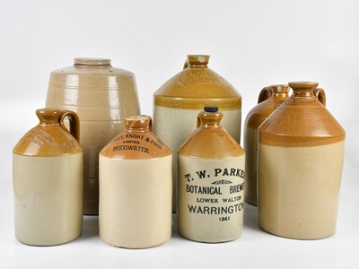 Lot 1266 - Seven stoneware flagons including advertising...