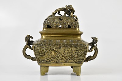 Lot 1022 - A Chinese bronze censer and cover, the pierced...