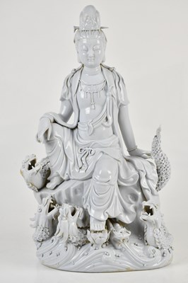 Lot 1111 - A Chinese Blanc de Chine model of Guanyin...