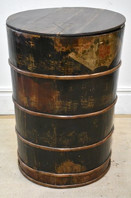 Lot 1054 - A Chinese stained barrel and cover, height 79cm.