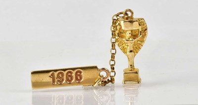 Lot 931 - A 9ct yellow gold Jules Rimet World Cup and...