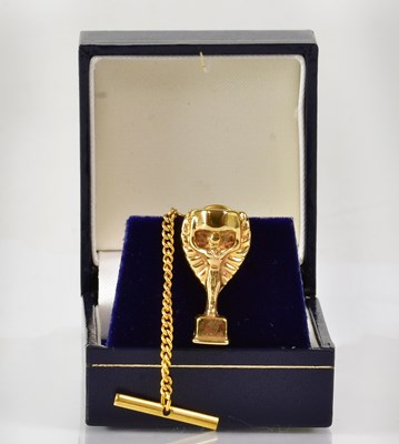 Lot 933 - A 9ct yellow gold Jules Rimet World Cup tie...