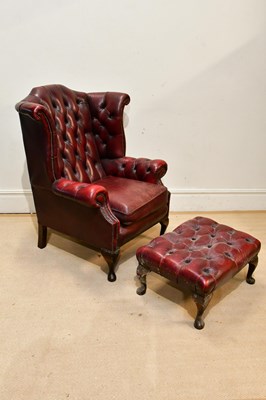 Lot 106 - A George III style red leather wing back...