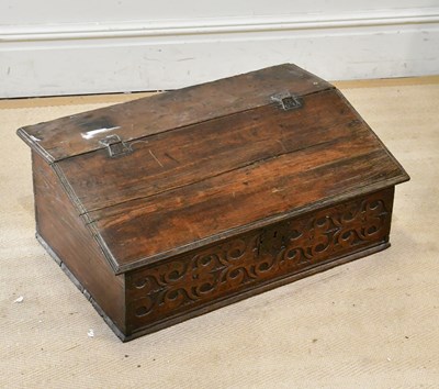 Lot 242 - An 18th century carved oak bible box, width 74cm.