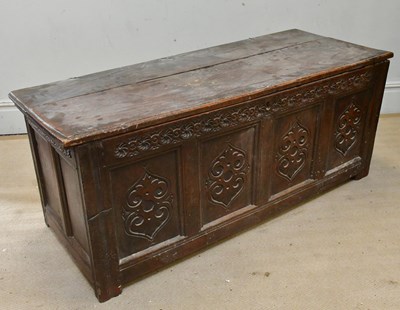 Lot 234 - An 18th century panelled oak coffer, with...