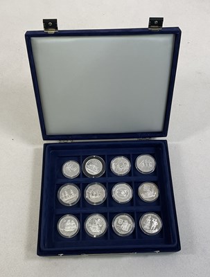 Lot 687 - Twelve shipping themed silver proof coins,...