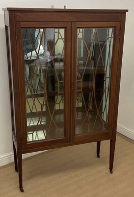 Lot 804 - An Edwardian mahogany and line inlaid two door...