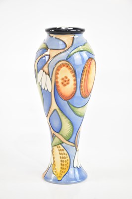 Lot 424 - MOORCROFT; a blue ground vase decorated with...