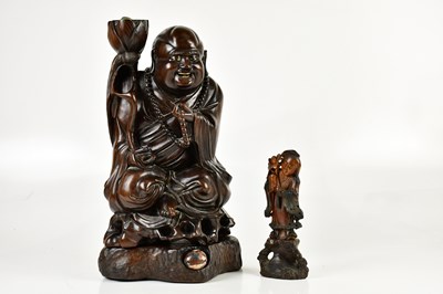 Lot 1043 - A large Chinese root wood figure representing...