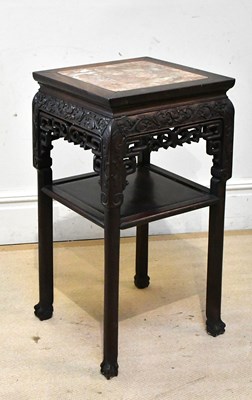 Lot 1040 - A Chinese carved rosewood two tier jardinière...