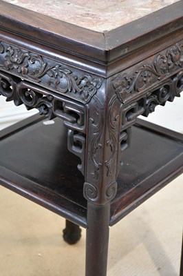 Lot 1040 - A Chinese carved rosewood two tier jardinière...