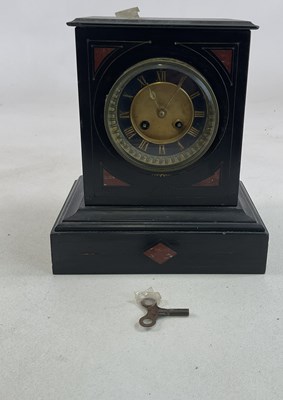 Lot 707 - A slate mantel clock striking on a bell, the...