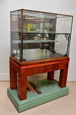 Lot 91 - A large glazed display cabinet with brass...