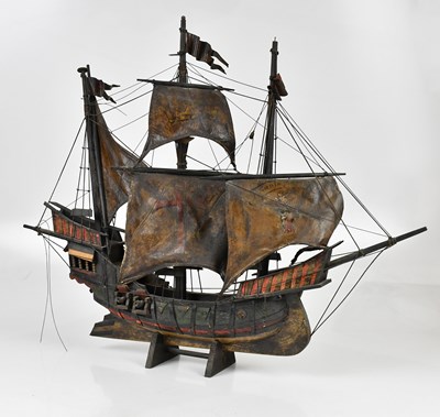 Lot 1298 - A decorative wooden model of a ship, height 67cm.