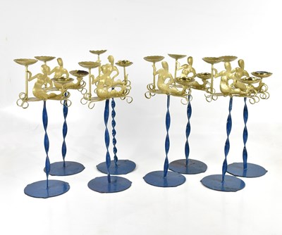 Lot 374 - Eight decorative gilt and blue painted candle...