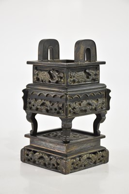 Lot 1063 - A Chinese cast metal twin handled censer,...