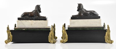 Lot 1396 - A pair of reproduction bronze sphinxes,...