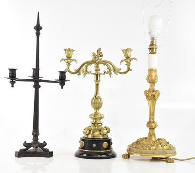 Lot 376 - An ormolu candlestick with cast Rococo style...