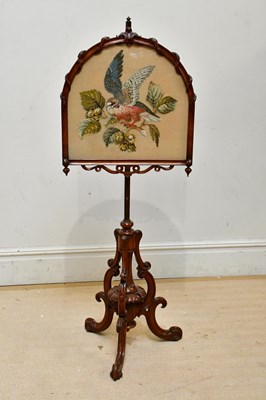 Lot 82 - A Victorian rosewood pole screen, the arch...