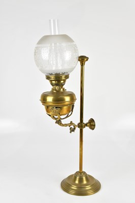 Lot 383 - A Victorian brass adjustable oil lamp with...