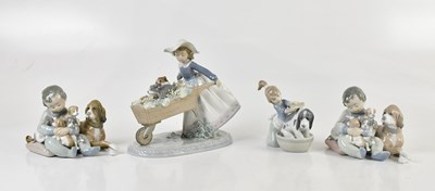 Lot 471 - LLADRÓ; four figures including a girl pushing...