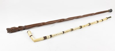 Lot 1272 - A resin and bone walking stick, inscribed 'RE'...