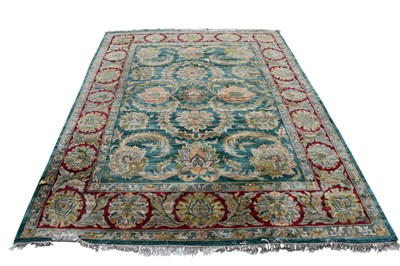 Lot 294 - A large hand knotted woollen carpet, with...