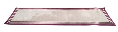 Lot 305 - A decorative modern runner, with maroon border...