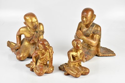 Lot 1160 - A pair of Thai gilt painted wood figures of...