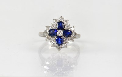 Lot 824 - An 18ct white gold floral cluster ring set...